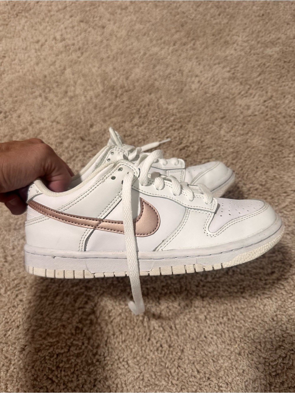 Nike White Low-Top Sneakers with Metallic Rose Swoosh